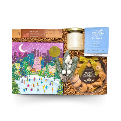 Cozy winter puzzle gift box with candle, tea, and festive treats by Black Bow Gift Co.