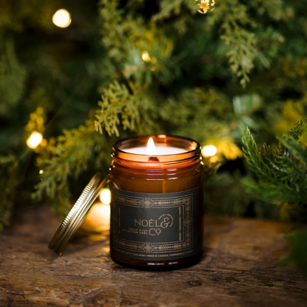 Fresh evergreen branches and winter woodland-inspired décor creating a cozy, festive holiday atmosphere.