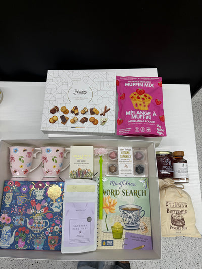 XL luxury keepsake gift box featuring floral mugs, lavender tea, pancake mix, maple syrup, candle, puzzle, word search book, and gourmet treats.