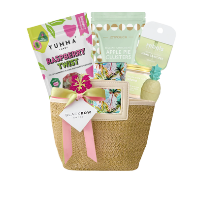 Island Time tropical gift featuring a reusable straw purse filled with vacation-inspired self-care treats, sweet snacks, and cheerful relaxation essentials. Beautifully arranged with bright tropical accents, ribbon, and seasonal details, creating a fun and thoughtful gift perfect for birthdays, thank-you gifts, self-care, and summer celebrations.