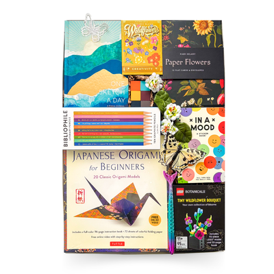 Luxury creative gift box featuring a sketch journal, watercolour paints, coloured pencils, origami kit, LEGO® Botanicals Tiny Wildflower Bouquet, floral stationery, sticker book, and premium creativity-inspired gifts.