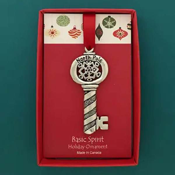Boxed North Pole key holiday ornament with a vintage-inspired red and cream design, reading “North Pole” and “Basic Spirit Holiday Ornament.”