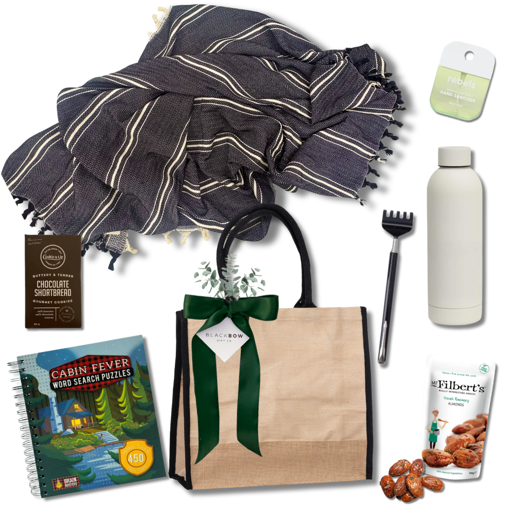 Kick Back get well and recovery gift with cozy throw blanket, insulated bottle, snacks, puzzle book and practical comfort essentials.

