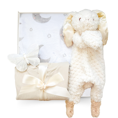 Little Dreamer baby gift box with neutral sleeper, plush bunny, moon blanket, and optional luxury sleep essentials for mom and baby.