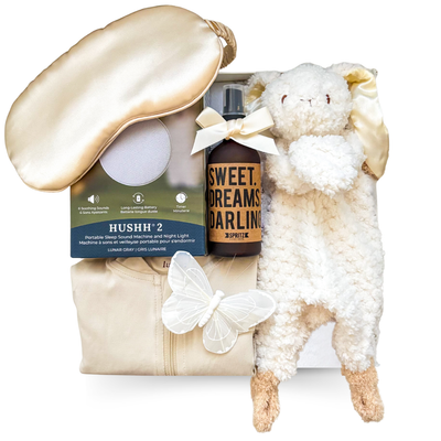 Little Dreamer baby gift box with neutral sleeper, plush bunny, moon blanket, and optional luxury sleep essentials for mom and baby.