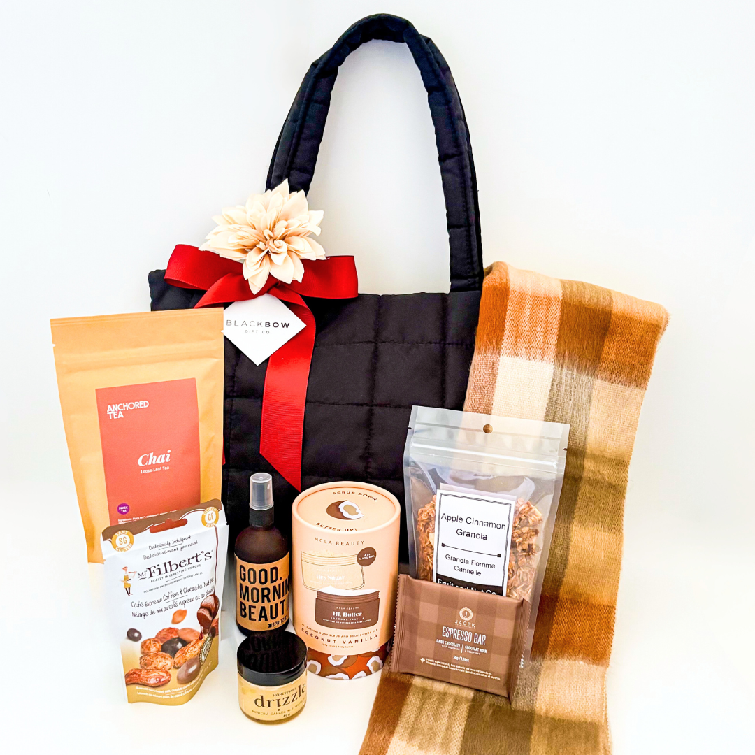 Luxe on the Go puff gift bag styled with neutral florals and rust ribbon for an elevated look.