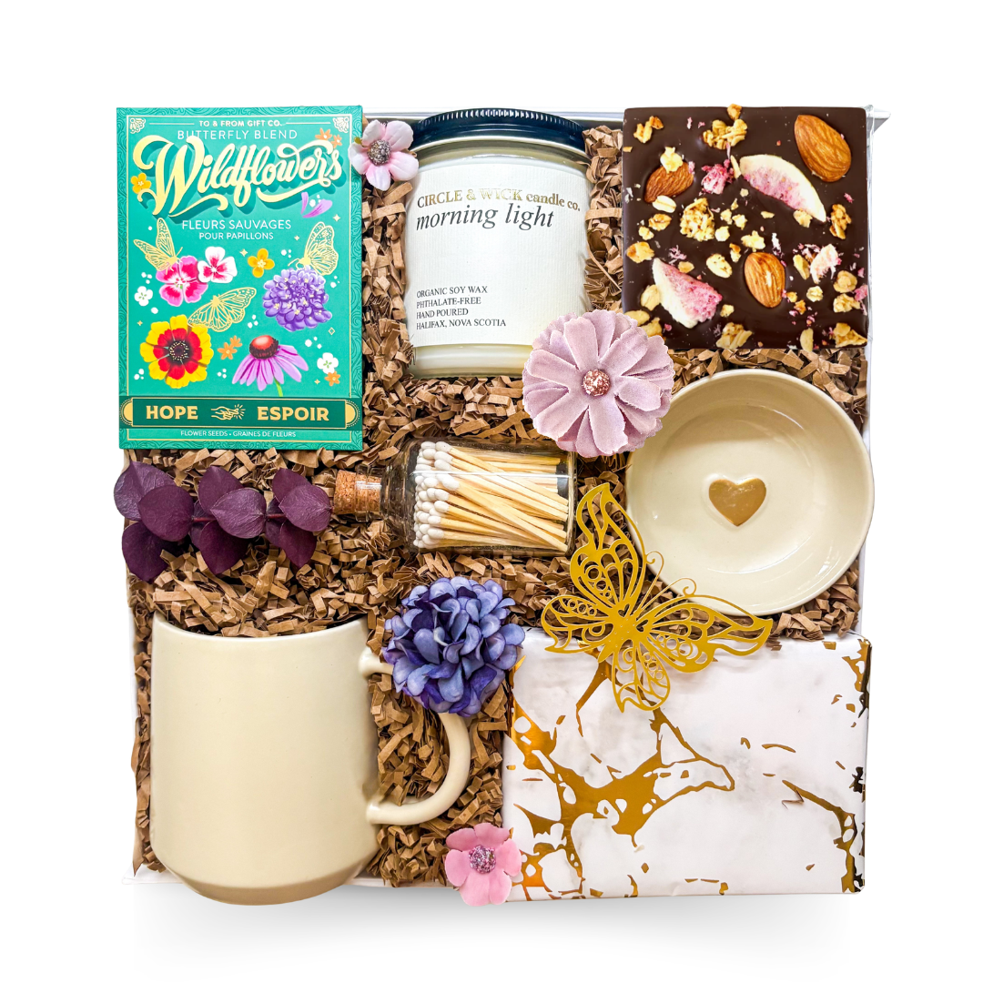 Morning Light self-care gift box with wildflower seeds, Morning Light soy candle, artisan chocolate, ceramic mug, heart trinket dish, and premium gift packaging.
