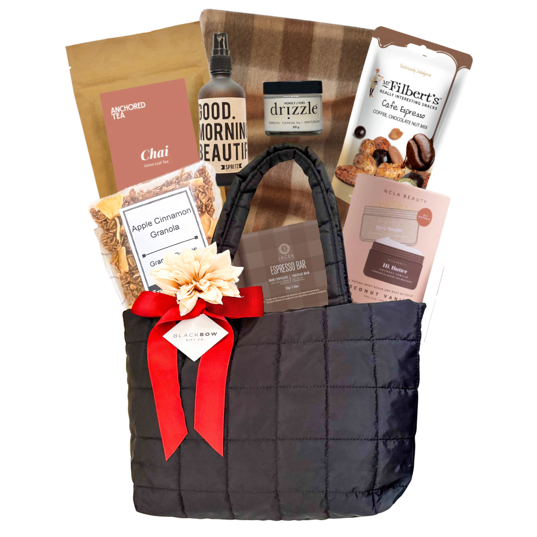 Luxe on the Go puff gift bag styled with neutral florals and rust ribbon for an elevated look.