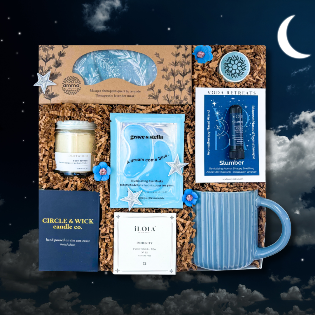 Gift set with candle, mug, and cards against a night sky background