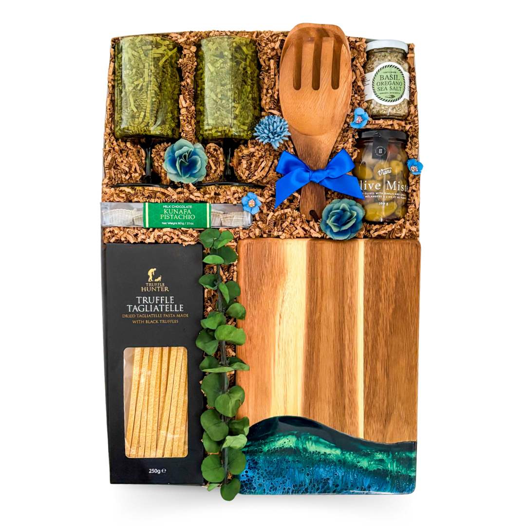 Northern Indulgence Gift Box styled in Northern Lights hues with gourmet delicacies, resin board, and optional blanket for an elevated culinary experience.