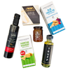 Northern Indulgence Gift Box styled in Northern Lights hues with gourmet delicacies, resin board, and optional blanket for an elevated culinary experience.
