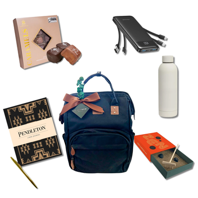 On the Go gift featuring a black backpack with insulated cooler section, reusable bottle, Pendleton journal, chocolates and relaxation essentials.