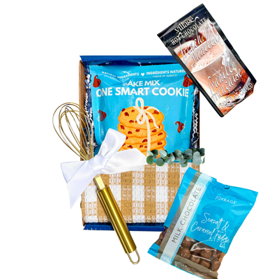 Blue mailer box gift with a cozy cookie-themed experience and warm seasonal accents.