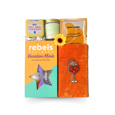 Out of Office vacation-inspired gift with eye masks, candle, gourmet almonds, tropical seasoning, vacation minis and playful relaxation extras by Black Bow Gift Co.