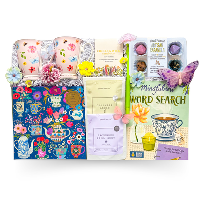 XL luxury keepsake gift box featuring floral mugs, lavender tea, pancake mix, maple syrup, candle, puzzle, word search book, and gourmet treats.