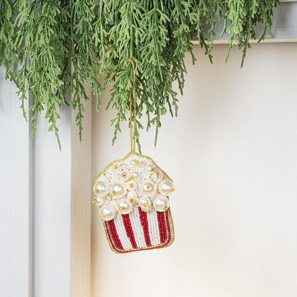 Festive popcorn-inspired Christmas ornament featuring pearly beads and classic red stripes for a playful holiday tree decoration.