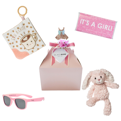Pink Skies Ahead baby girl gift box with plush bunny, silicone teething book, baby sunglasses, and chocolate.