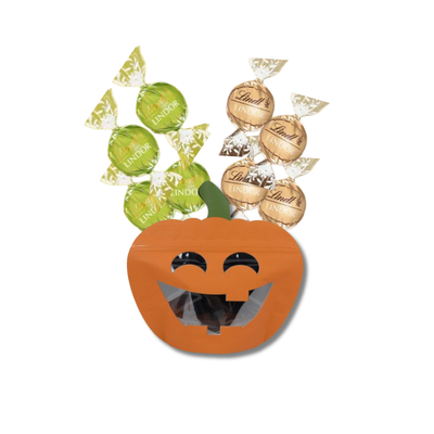 Halloween pumpkin-shaped chocolate pouch filled with green and gold Lindt Lindor chocolates.
