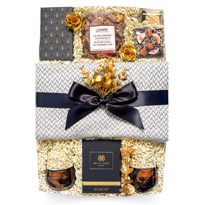 Quiet Luxury Gift Box featuring cashmere blend blanket, resin stemless wine glasses and luxury candle by Black Bow Gift Co.