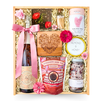 Rosé & Relaxation luxury rosé and spa gift box with candle, chocolates, bath salts and heart accents in a keepsake wood box by Black Bow Gift Co.