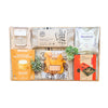 recovery edit gift items displayed on top of Grey Striped blanket on Bamboo tray
