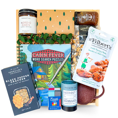 Luxury comfort gift box with blanket, tea, and cozy accents