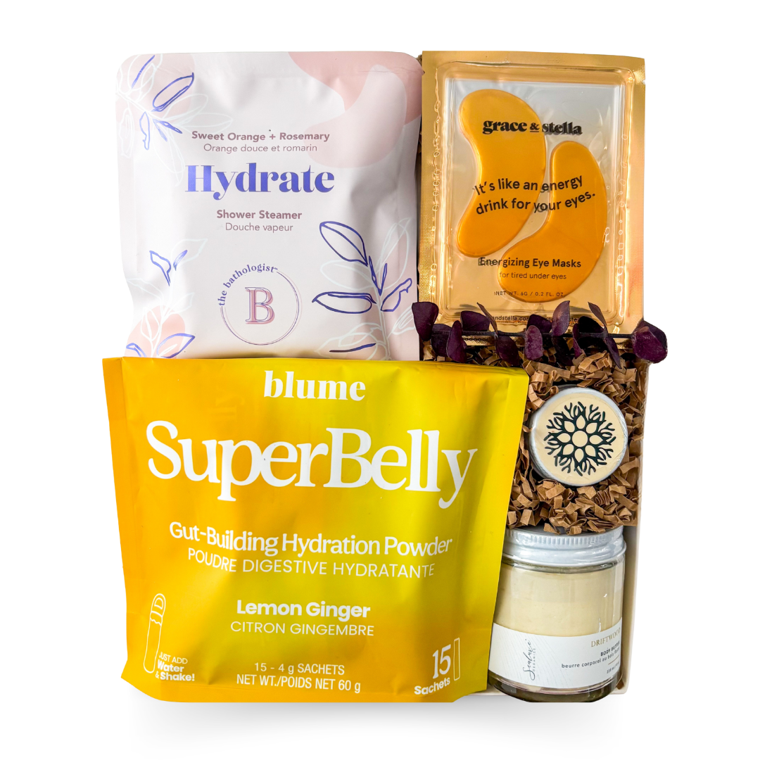 Self care gift box featuring wellness essentials, hydration support, shower steamer, eye masks, body care products and nourishing granola by Black Bow Gift Co.

