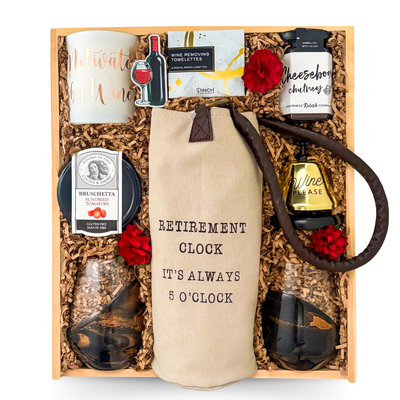 Retirement Uncorked retirement gift box featuring wine accessories, charcuterie snacks, olives, crackers, brie cheese, wine glasses, and gourmet entertaining items in a keepsake wood box curated by Black Bow Gift Co.