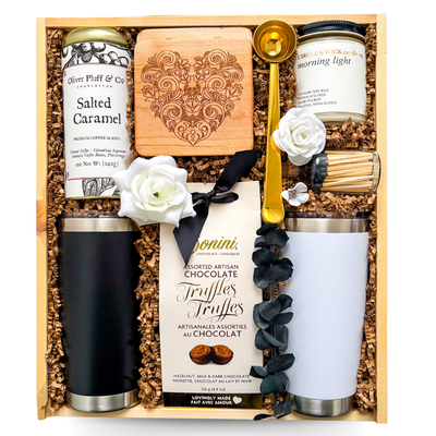 Romantic couple gift in a custom wooden box with drinkware, candle, and cozy details, styled for slow mornings together.