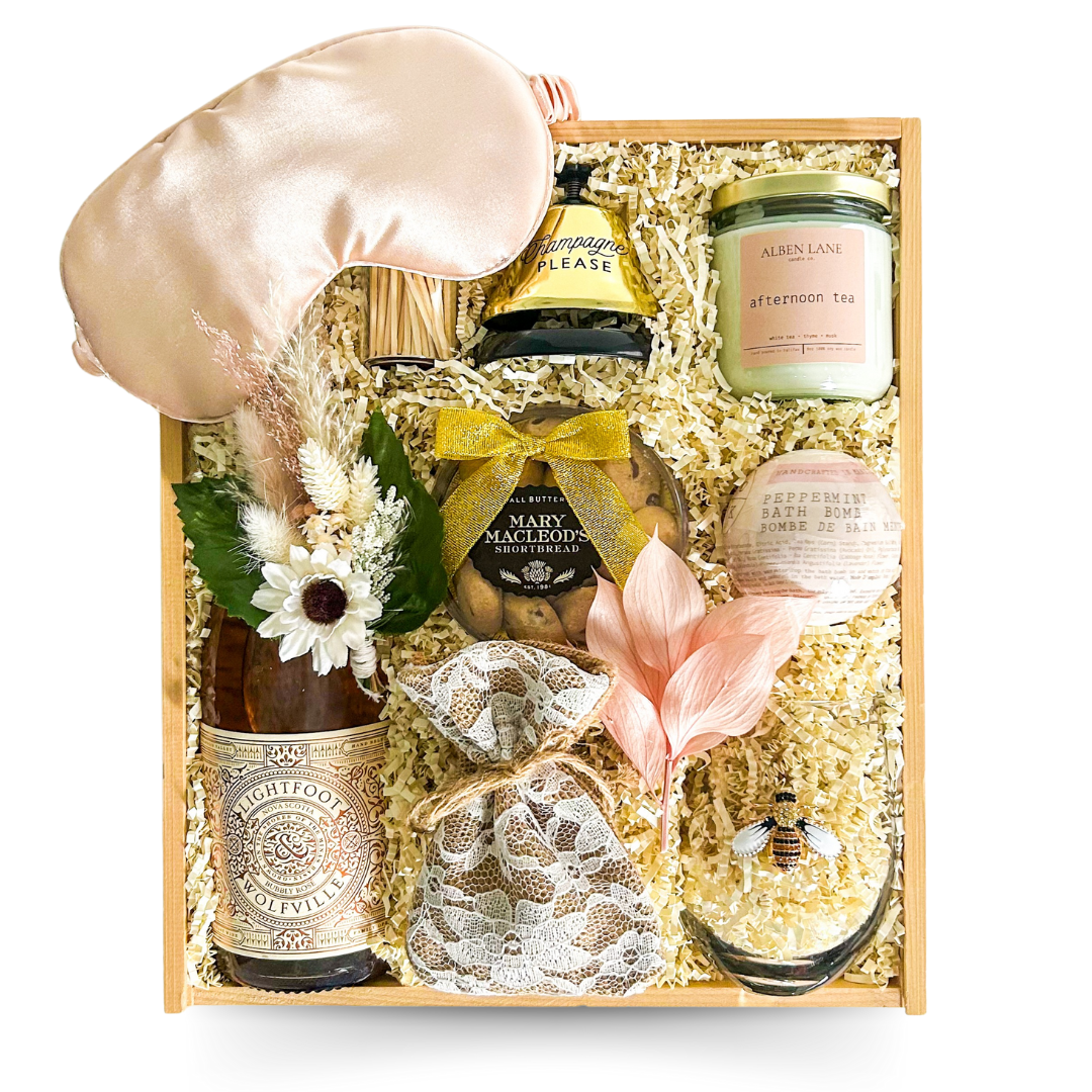 osé All Day luxury gift box styled with pink-inspired accents, wine glass, and self-care touches.