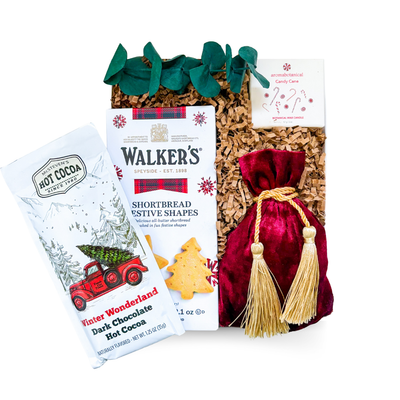 Santa’s Treats small holiday gift box with cookies, chocolates, and a candy cane candle