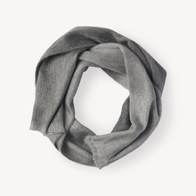 Soft natural alpaca scarf in a grey ombre design, styled in a loop to showcase its lightweight and cozy texture.