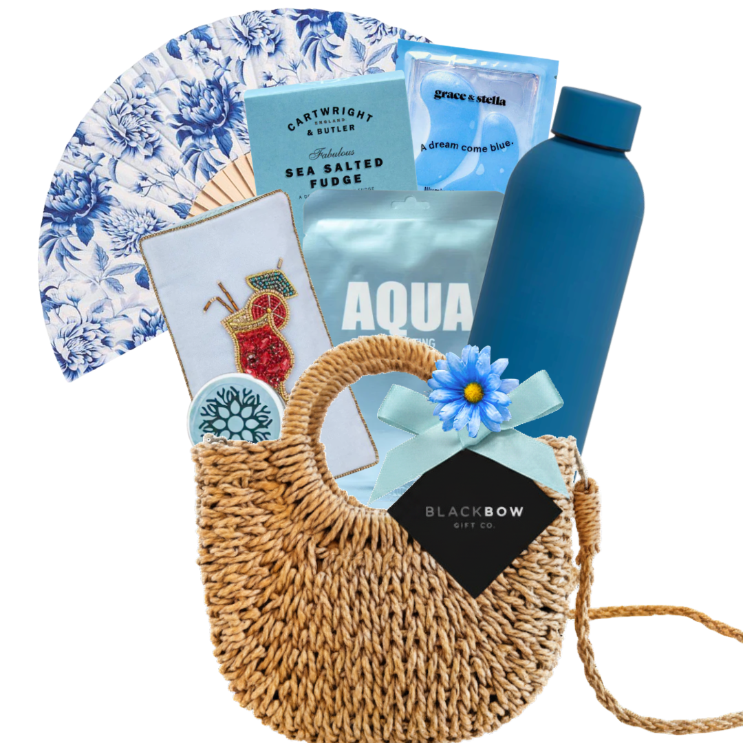 Beach-inspired gift purse featuring insulated water bottle, hand fan, eye mask, self-care essentials, and woven purse presentation by Black Bow Gift Co.

