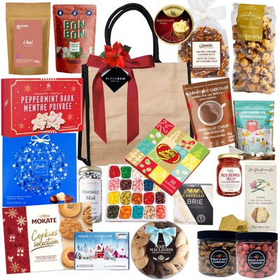 Premium holiday gift bag with festive treats in a jute tote by Black Bow Gift Co.