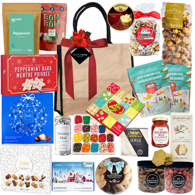 Premium holiday gift bag with festive treats in a jute tote by Black Bow Gift Co.