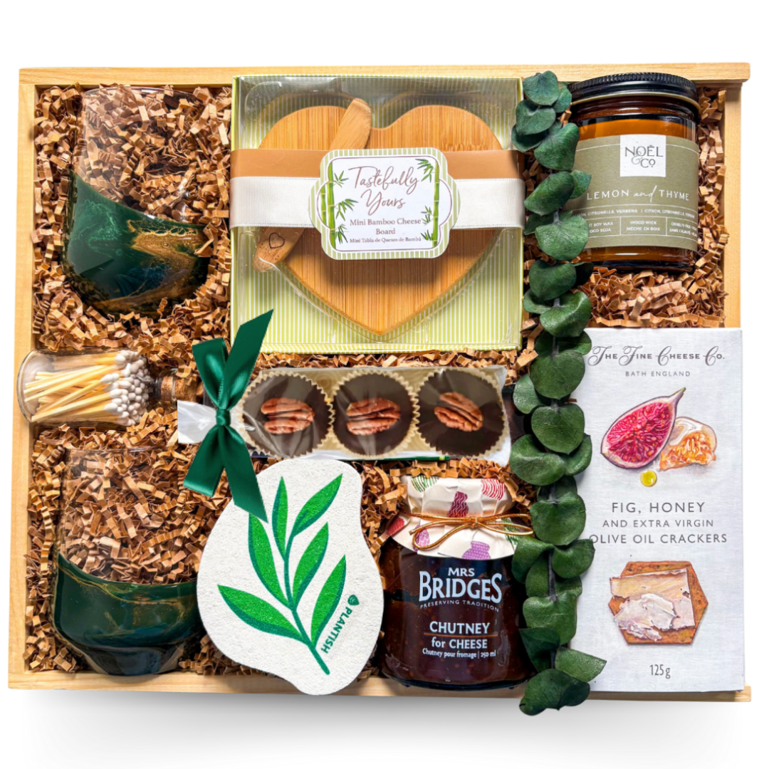 Indulgent wine and cheese gift with heart-shaped board and wine glasses styled for shared moments.