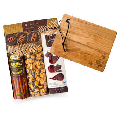 Simply Merry gourmet gift with chocolates, sweet treats and wooden serving board, beautifully arranged by Black Bow Gift Co.