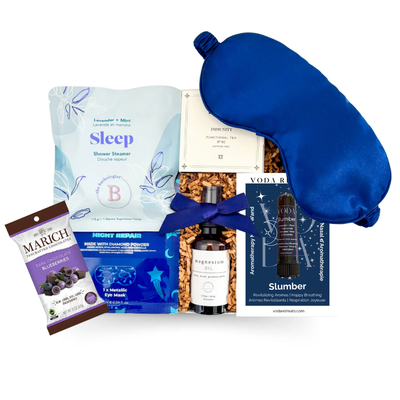Luxury sleep gift box with lavender shower steamer, magnesium spray, satin sleep mask, aromatherapy inhaler, functional tea, night eye repair and dark chocolate blueberries  — a relaxing wellness gift for better sleep, self-care, corporate gifting and get well wishes.