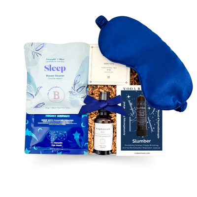 Luxury sleep gift box with lavender shower steamer, magnesium spray, satin sleep mask, aromatherapy inhaler, functional tea, night eye repair and dark chocolate blueberries  — a relaxing wellness gift for better sleep, self-care, corporate gifting and get well wishes.