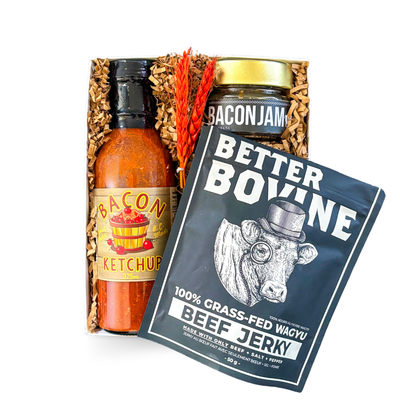 Gourmet snack gift box featuring bacon jam, bacon ketchup, wagyu beef jerky, and barbecue-inspired treats presented by Black Bow Gift Co.