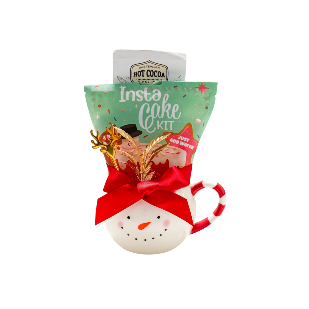 Snow Day Treat snowman mug gift with reindeer spoon, hot chocolate, and mug cake mix wrapped in cello.