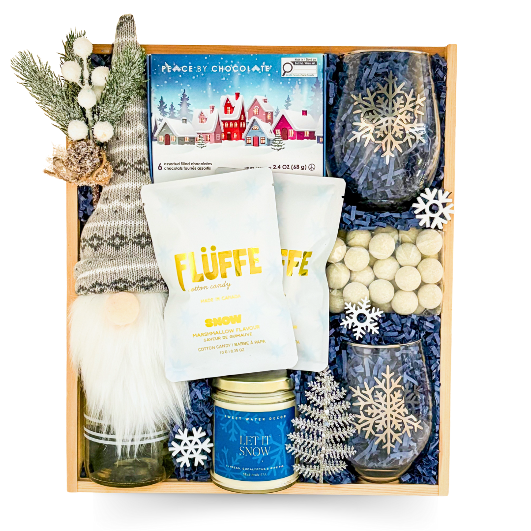 Snow Much Fun winter gift box with blue-and-white snowflake accents arranged in a wooden keepsake box.
