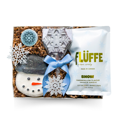 Small winter gift box with snowy themed treats and cozy seasonal accents.