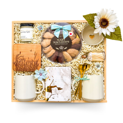 Cozy gift with tea and a snack styled for warm, comforting moments.