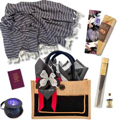 Spooky Season Halloween gift basket with cozy throw, incense, matches, Halloween book and sweet treats