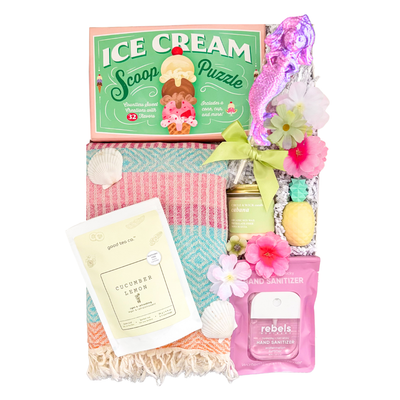 Summer Fun gift box featuring a Turkish towel, puzzle, candle, tea, pineapple lip balm, lollipop, and sweet treats by Black Bow Gift Co.