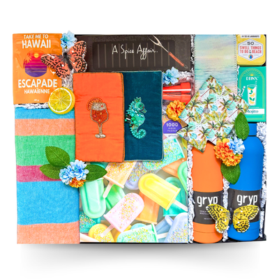 Luxury summer gift basket in a large high-gloss black magnetic keepsake gift box featuring premium insulated bottles, beach towel, passport holders, gourmet treats, summer games, barbecue sauces, hydration essentials, and colourful seasonal accessories.