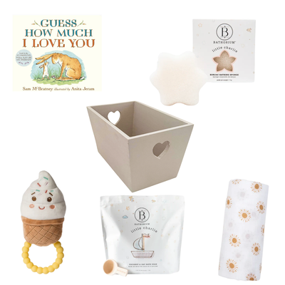 Sunshine & Snuggles neutral baby gift box with Guess How Much I Love You board book, Bathorium Little Charlie baby care, sunshine muslin swaddle, ice cream plush, and premium gift packaging.