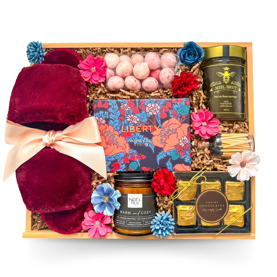 Sweet Escape feminine relaxation gift featuring cozy comforts, chocolates, candle and playing cards in a wooden tray.

