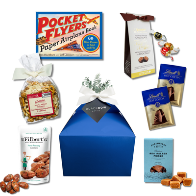 Take Five snack gift box with chocolates, maple pecan crunch, savoury snacks and a paper airplane activity book.